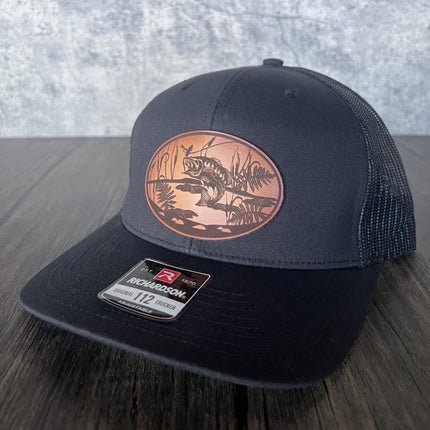 Close-up of leather patch featuring bass leaping to catch a lure