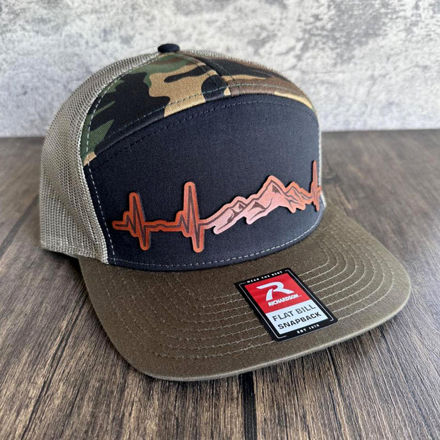 Side angle of outdoor trucker hat showing camo design and mesh back