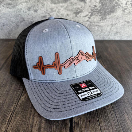 Trucker hat with engraved patch ideal for camping or hiking trips
