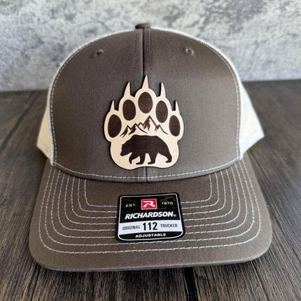 Front view of Richardson 112 hat with engraved bear claw leather patch
