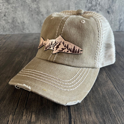 Front view of khaki unstructured cap with leather mountain fish patch