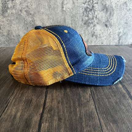 Side profile showcasing mesh back and velcro closure of the mountain hat
