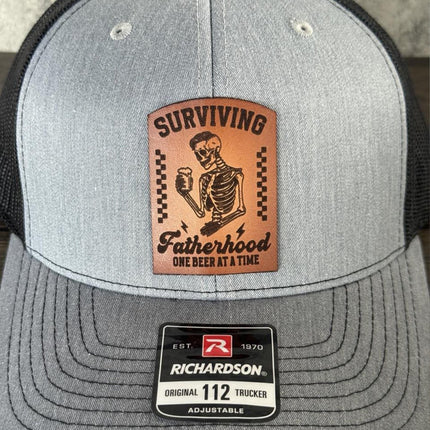 Surviving Fatherhood Hat, Leather Patch Dad Hat, Richardson 112 Trucker Cap, Funny Beer Dad Gift, Father's Day Hat - Patch Palooza
