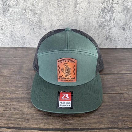 Surviving Fatherhood Hat, Leather Patch Dad Hat, Richardson 168 Flat Bill Snapback, Funny Beer Dad Gift, Father's Day Hat - Patch Palooza